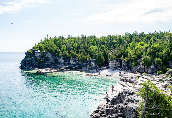oneibccom2024 Indian Head Cove is a beach consisting of flat, limestone rocks & white boulder beach in Bruce Peninsula National Park, accessible via trails.