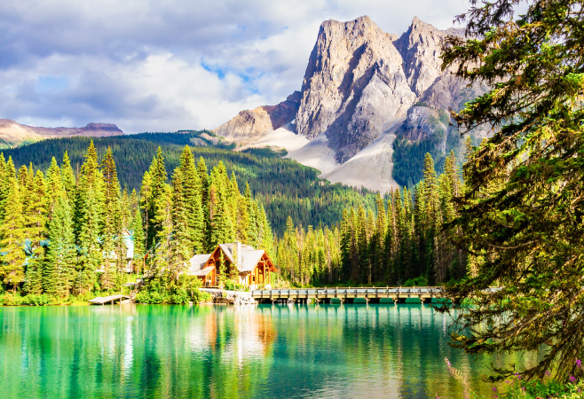 Emerald Lake is famous for its striking turquoise-green hue, created by fine glacial sediment suspended in the water. 