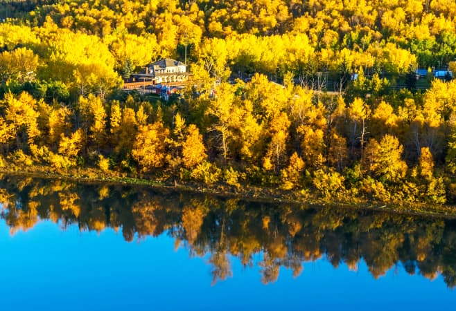 Experience the rolling hills, glassy lakes, and star-filled skies of Elk Island National Park Experience the rolling hills, glassy lakes, and star-filled skies of Elk Island National Park