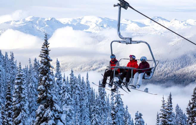 Travelers going up the mountain on a chairlift