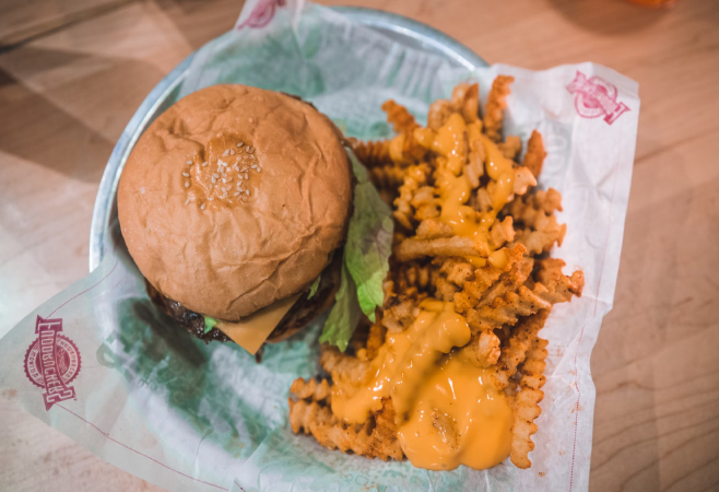 Authentic Canadian Poutine featuring deep-fried fries, poutine gravy and white cheddar cheese curds all tossed together.