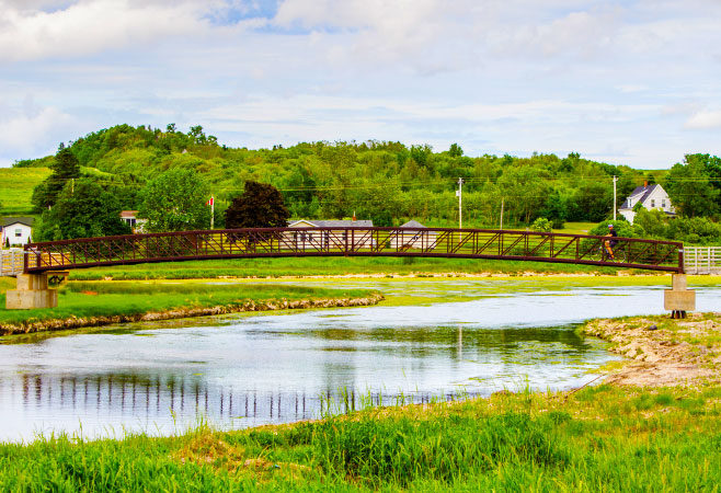 The Confederation Trail runs tip-to-tip across Prince Edward Island and is best explored on foot or bicycle