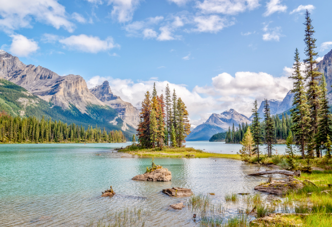 This glacial-fed lake is famed for its majestic peaks, blue-green water and Spirit Island This glacial-fed lake is famed for its majestic peaks, blue-green water and Spirit Island